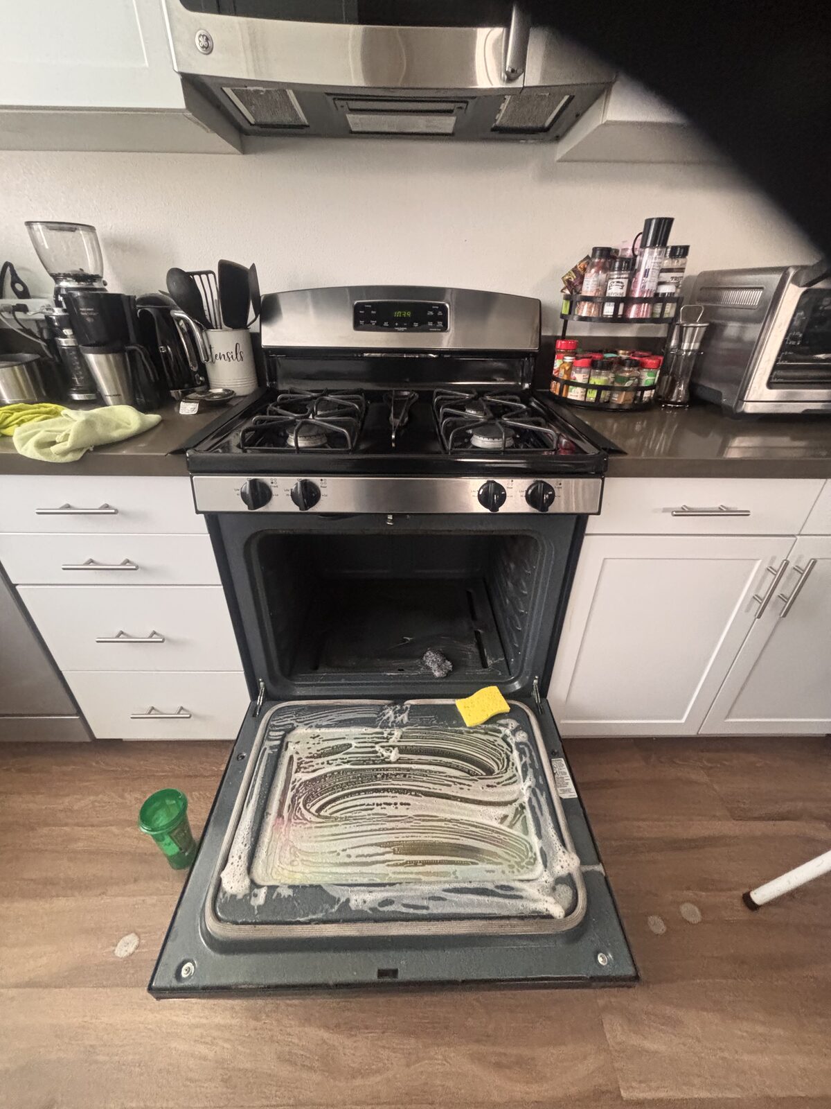 Oven door scrubbed down during a Scrub Bros deep clean
